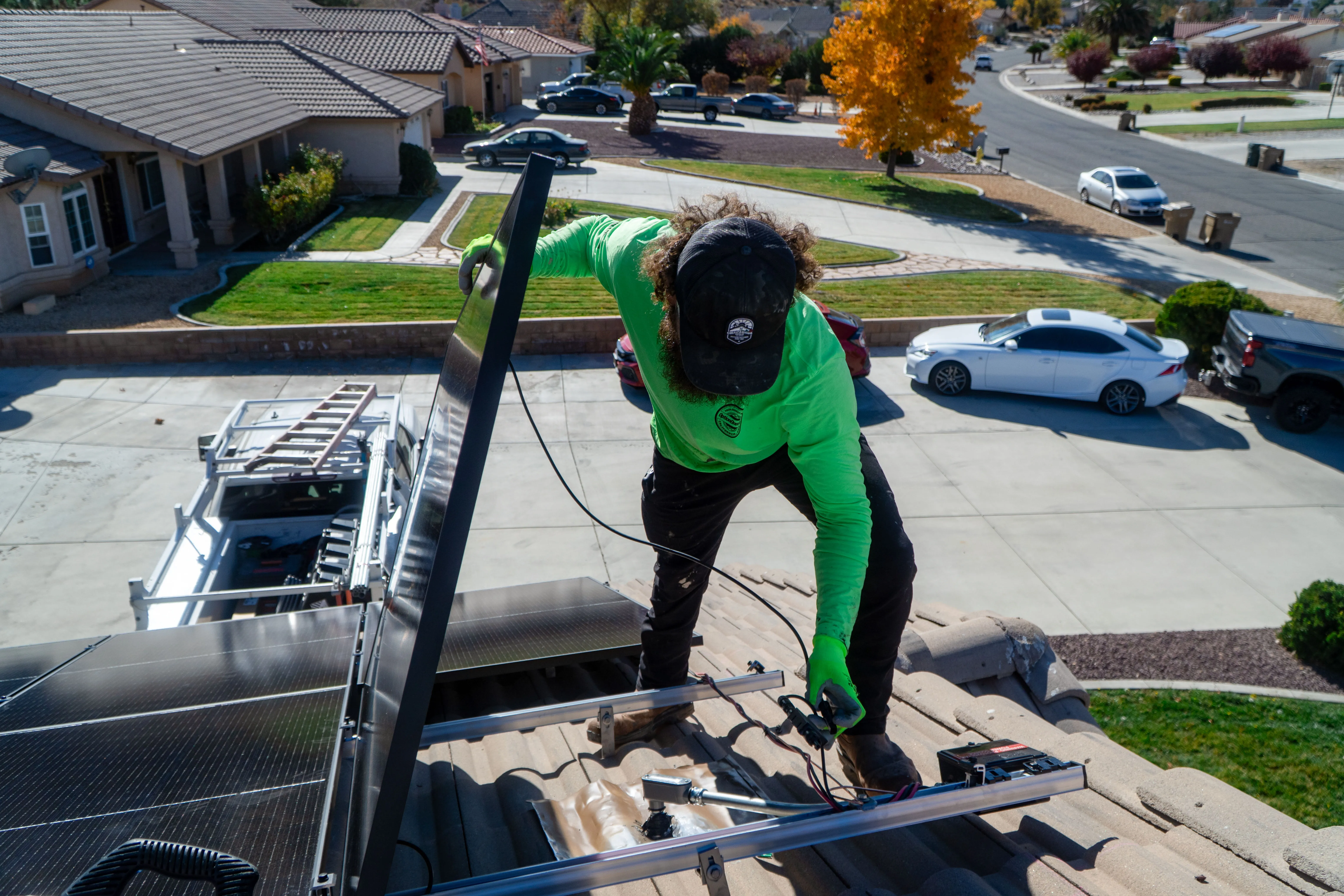 Option One Solar installer on a High Desert residential roof